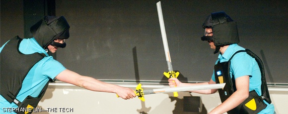 Nathan M. Robert ’13 stabs Eric A. Del Castillo ’13 in the chest with their toy set, the Legend of the Sword, during the Toy Playsentations in 10-250 on May 11. The Legend of the Sword contains two Nerf swords and two vests that have three pressure-triggered targets.