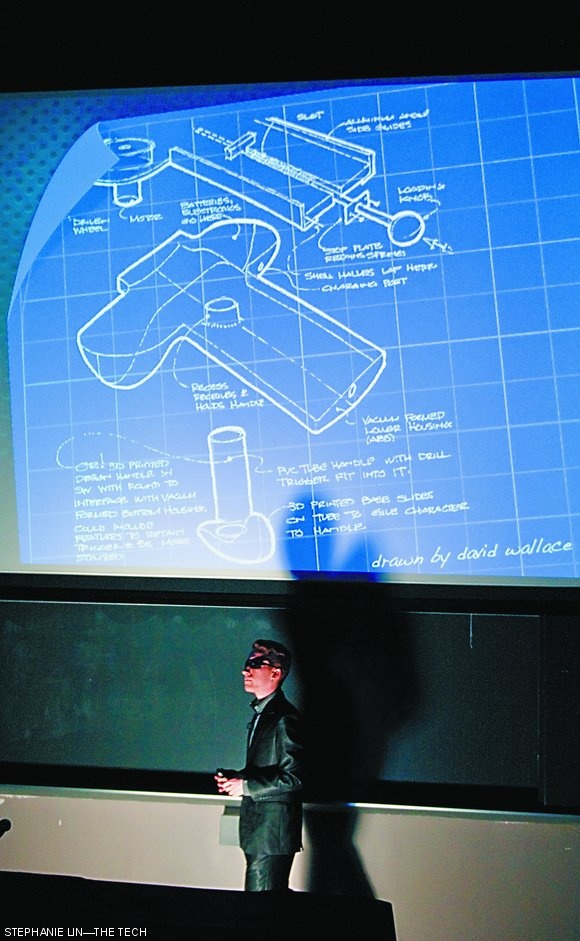 Remus Corp. Operative Jeremy V. Rossmann ’13 debriefs the audience about the Flyby, a powerful new weapon currently in the hands of dangerous gangsters, during the 2.00b Toy Playsentation in 10-250 on May 11. The Flyby was one of fifteen toys presented at the Playsentation.