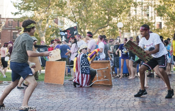 East and west campus residents duke it out with water balloons and water cannons at the East vs. West Water War in front of Kresge on Monday. The Water War is an annual REX tradition.