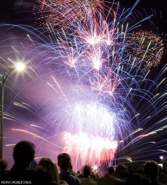 To enjoy the Boston Pops’ July 4th concert and the fireworks, thousands of people gathered on the Cambridge side of the Charles River across from the Esplanade