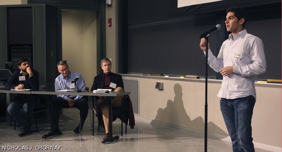 Jason Gurwin of Harvard Business school pitches his team’s idea to the audience and a panel of three judges at the finale of the MIT 100K Executive summary contest on Thursday in 10-250. He described his team’s business idea, which won the competition, as “the first social and competitive platform for savings.”