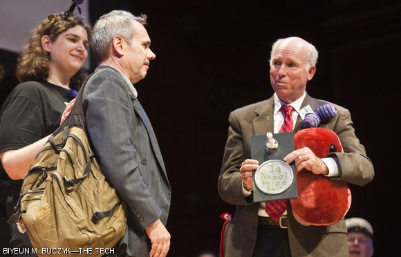 Gareth Jones accepts his Ig Nobel Prize in Biology during the Ig Nobel Awards Ceremony on Thursday. Each of the ten winners received a Petri dish and a stuffed bacteria plushie.