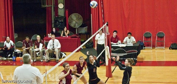 Sharon S. Hao ’14 sets the ball as Emma S. Gargus ’14 prepares to spike in the game against Springfield College on Tuesday. Despite winning the first set, the Engineers lost the game.