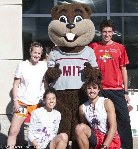 The winners of the Beaver Dash, (left to right) Kaitlin R. Goldstein G (1st place, women), Donna M. Golach ‘12 (2nd place, women), Scott T. Landers (2nd place, men), and Antonio Tugores-Garcia G (1st place, men), pose with Tim the Beaver after their race.