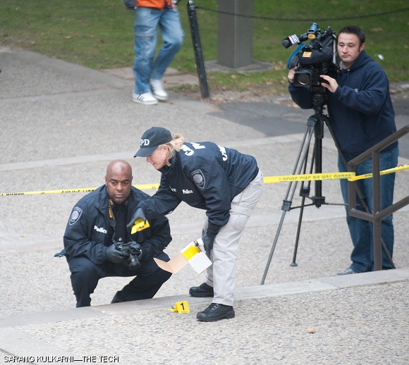 Officers place evidence markers on the steps outside the Stratton Student Center around 5 p.m. today after a stabbing.