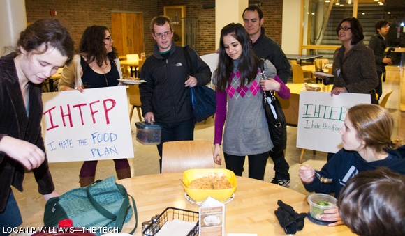 Students protest the new dining plan next fall by eating food in Baker Dining yesterday evening that they had prepared themselves.