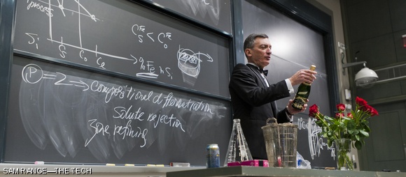 Materials Science Professor Donald R. Sadoway removes the foil on a bottle of Champagne Wednesday in his final lecture for 3.091, the solid-state chemistry GIR class he has taught for 16 years. Following a lecture on eutectic properties of mixtures, Sadoway explained the chemistry of Champagne production and demonstrated the proper serving of the beverage.