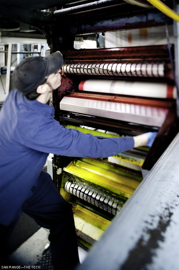 Workers at Mass Web adjust levers on each color press so ink is fed onto rollers such that each page receives sufficient but not excessive amounts of ink across the span of the printing plate.