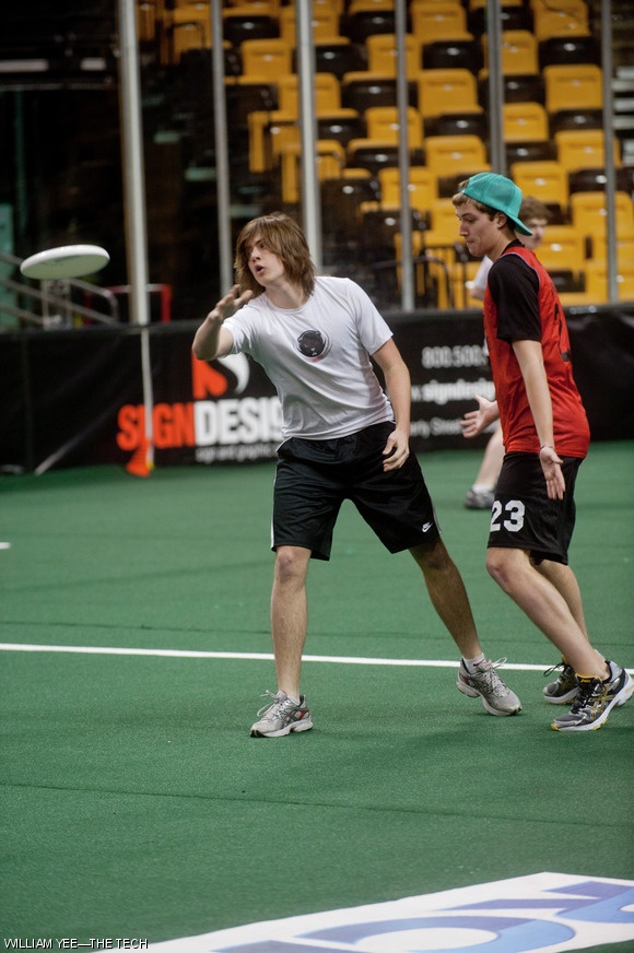 Robert A. Weber ’13 throws the frisbee under pressure from a Northeastern defender. The Engineers and the Northeastern Huskies played an exhibition game at TD Garden on Sunday, March 6.
