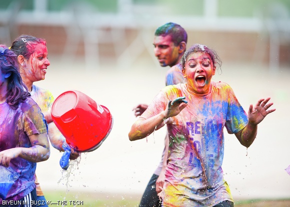 Students throw colored powder in celebration of the spring season at MIT’s Holi celebration on Sunday. Holi is celebrated widely in South Asia. For more photos of the event, p. 10.