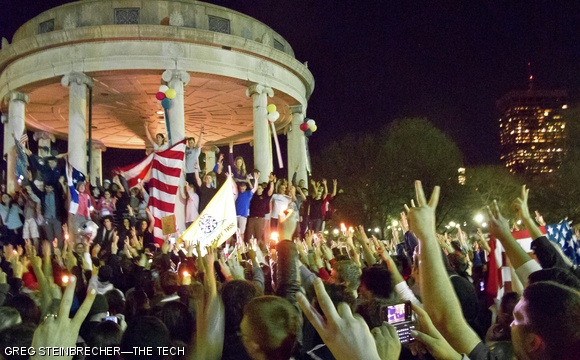 A crowd mostly composed of college students gathered at the Parkman Bandstand on Boston Common late Sunday evening to celebrate the death of terrorist Osama bin Laden. Two days ago, President Barack Obama announced that bin Laden was killed by a joint ground operation of the Navy SEALs and the CIA. The crowd sustained itself for almost two hours with an ebullient atmosphere, chanting and occasionally singing. Police officers stood nearby to monitor the energetic gathering. The students seemed to be predominantly from Boston University and MIT, with sparser showings from other area colleges.