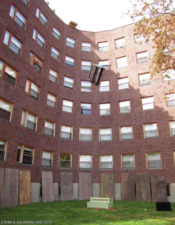 A decrepit upright piano sails off the roof of Baker House during the traditional Spring drop date celebration on Memorial Drive. The drop was held over a week after the April 21 drop date to coincide with MIT’s Under The Dome open house.