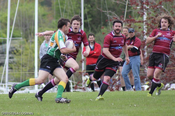 Fullback Michael P. Byrne G eyes up the opposition for a tackle with the support of scrumhalf Jason Shepherd and winger Matthew R. Adendorff G in the 2011 NERFU Cup Tournament semifinal game against Springfield Rugby Football Club. MIT beat Springfield 29-10 and later went on to beat Saratoga Rugby Football Club and win the cup.