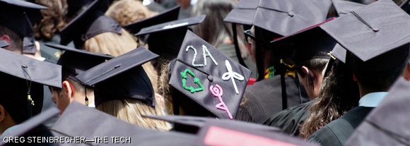 Some students displayed symbols representing their major on their mortarboards.