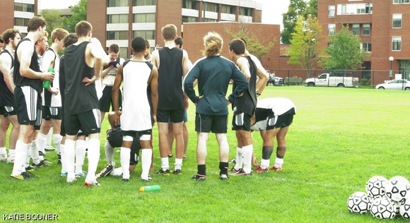 Coach Mike Singleton gives the MIT men’s soccer team a talk during an intense early season practice this Thursday.