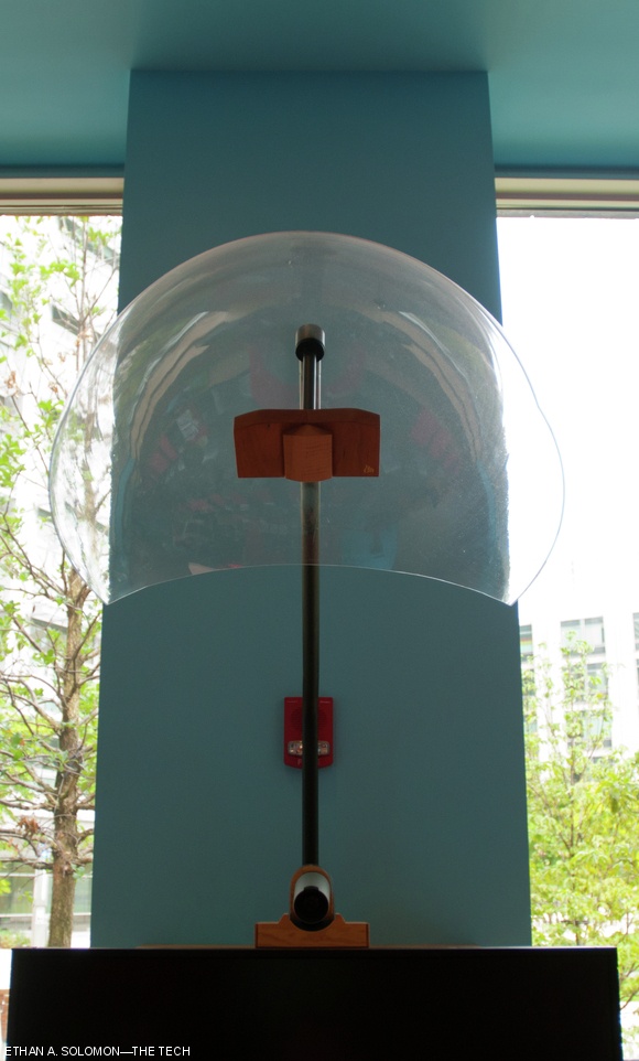Speakers placed in a plastic dome above the table of the wormhole direct audio to students at MIT from those at Stanford.