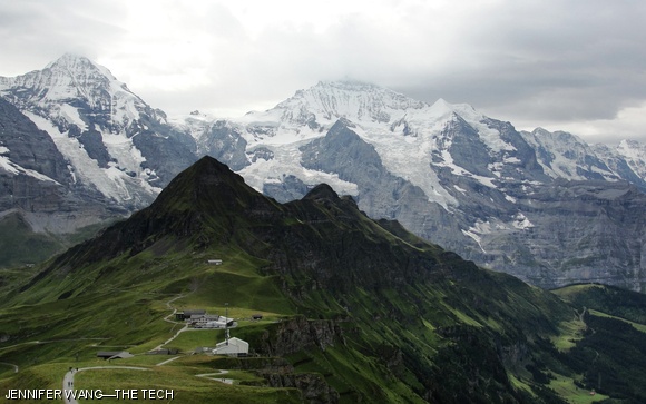 Männlichen, Switzerland, affords tourists breathtaking mountain views. Here, you can clearly see lush green areas in lower elevations and crisp snow at much higher elevations, even in the summer months.