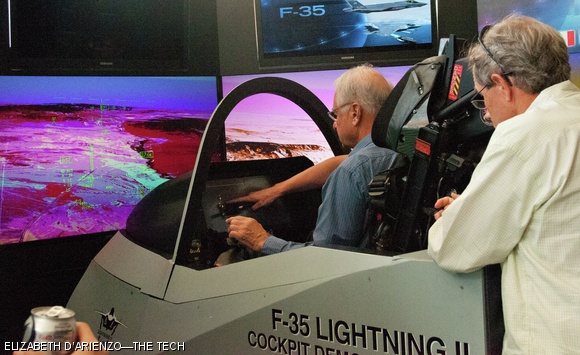 Professor Laurence R. Young ScD ’62, from MIT’s Department of Aeronautics and Astronautics, learns about some of the features in the Lockheed Martin Joint Strike Fighter simulator — brought to MIT with help from the Flying Club — in the Z-Center this past Tuesday. This F-35 simulation contains five screens displaying different outputs that the pilot would see in the actual plane.