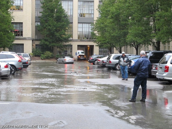 A water pipe broke under the Main Lot, between Buildings 3 and 5, shortly before 3:30 p.m. on Oct. 26. Water pressure cracked and lifted the asphalt in the middle of the parking lot, and overwhelmed the drains near the driveway under the Infinite Corridor in building 7. A pipe in the same lot burst in August, 2010, though that flooding was more substantial and took longer to subside. The water subsided about two hours after the initial flooding. Researchers at the Rohsenow Heat and Mass Transfer Laboratory, immediately next to the flooded driveway in the basement of the Infinite, expressed concern that waves from cars driving through would flood their lab — as happened in 2010.