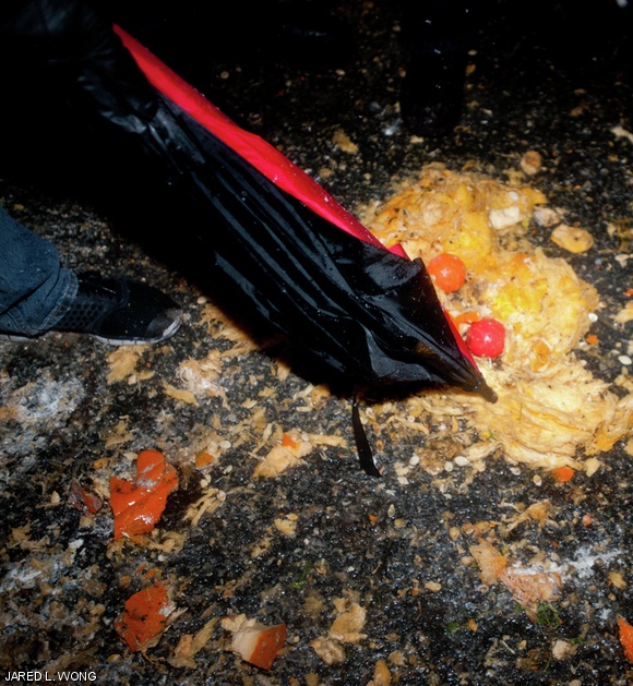 Tech chairman Joseph R. Maurer ’12 pokes at the remains of a broken pumpkin.