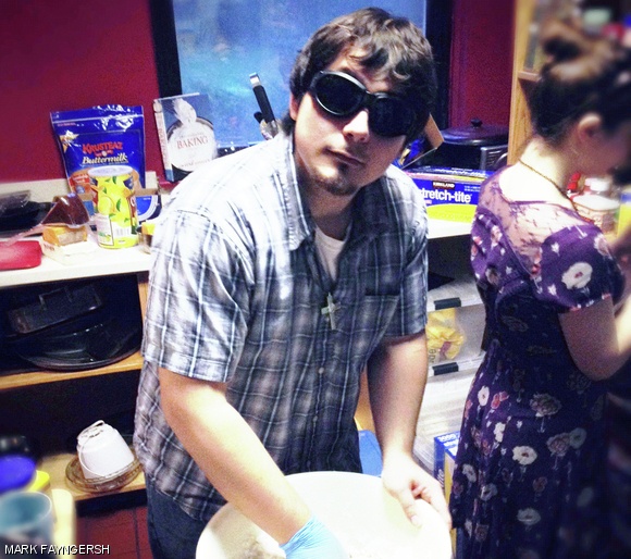 Oscar Figueroa ’12 “makes science” by mixing water and flour for filling pumpkins.
