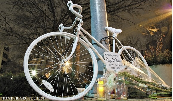 Flowers and candles lay before a ghost bike memorial dedicated to Phyo Kyaw ‘10. Kyaw was hit and killed by a truck while riding his bicycle on December 27.