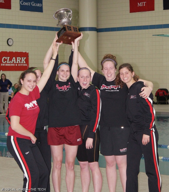 This weekend, MIT Women’s Swimming and Diving won the NEWMAC Championships for the first time in school history. After consistently taking second place, the Engineers beat rivals Springfield College 917.5 points to 894.5. The seniors of the team (from left to right), Diana E. LaScala-Gruenewald ’11, Elizabeth L. Stavely ’11 (partially obscured), Amy E. Jacobi ’11, Kaitlyn M. Creasey ’11, Caroline A. DeBoer ’11, and Lauren R. Hernley ’11, claim the first place trophy.