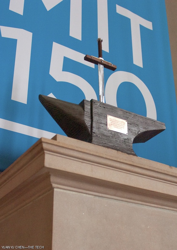 On Sunday morning, hackers placed a sword stuck in an anvil on one of the pedestals in Lobby 7. The hack, presumably to welcome the new chancellor, has a plaque inscribed “Who So Pulleth Out This Sword of this Stone and Anvil is the Rightwise Born Chancellor of The Institvte,” a reference to the novel and movie The Sword in the Stone. The sword is adorned with a number of MIT references: “Massachvsetts Institvte of Technology” and “MDCCCLXI,” the year the Institute was founded, are engraved on the blade; the bolt heads on the hilt spell out “X + I” to represent 2011; and the MIT seal is on the handle of the sword.