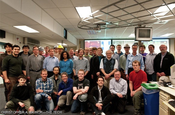 Several of the scientists and engineers who help operate Alcator C-Mod pose for a photograph in the main control room.