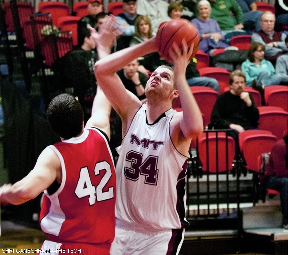 Noel Hollingsworth ’12, the team’s center, takes a shot against a stumbling RPI defender.