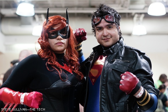 Two DC Comic cosplayers pose for a photo together in the hallways of Boston Comic-Con.