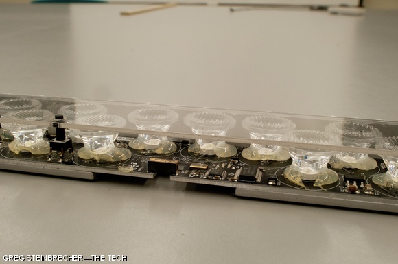Under the protective plexiglass cover, each device features 13 LEDs. Each pixel has a ridged plastic cover to direct the light up toward the window rather than back into the room.
