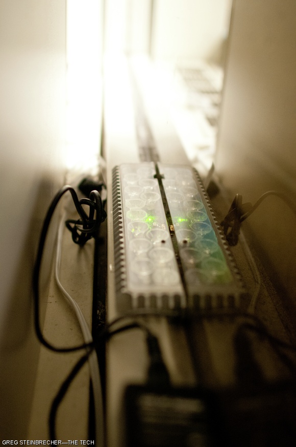 The status LED on this pixel glows green, indicating its readiness to turn on at the figurative flip of a switch. Each pixel features a button labeled “sleep” which, according to an e-mail sent to the EAPS department, will disable the pixel for three hours if the office occupant is bothered by the light and pushes it.