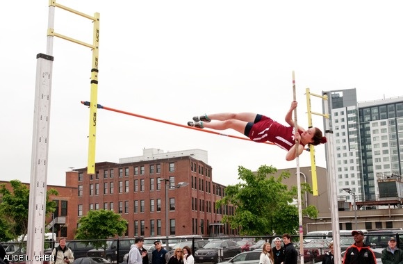 Rebecca J. Greene ’14 pole vaults. Teammate Lauren B. Kuntz ’13 placed second in the event. The women’s team finished second overall while the men’s team won the New England Championship.