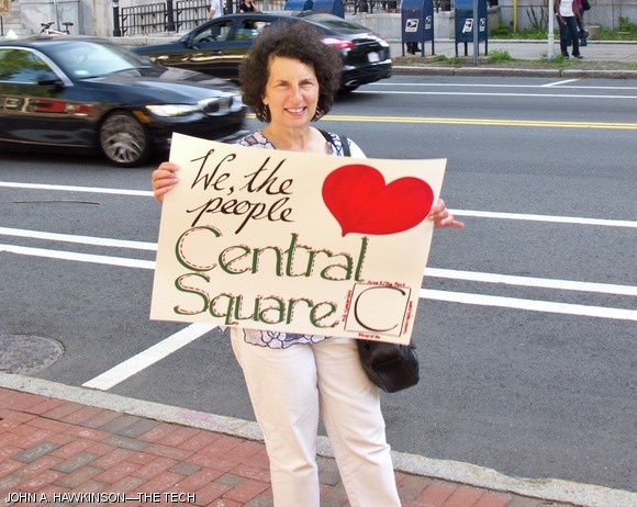 Susan Yanow, of the Area 4 Neighborhood Coaliton, protests the further development of Central Square on Monday in front of City Hall. Other protesters held signs with “Don’t Kendalize Central” and “No Permit 4 Forest City” written. Yanow is the author of a “downzoning”petition to institute a development moratorium in the area.