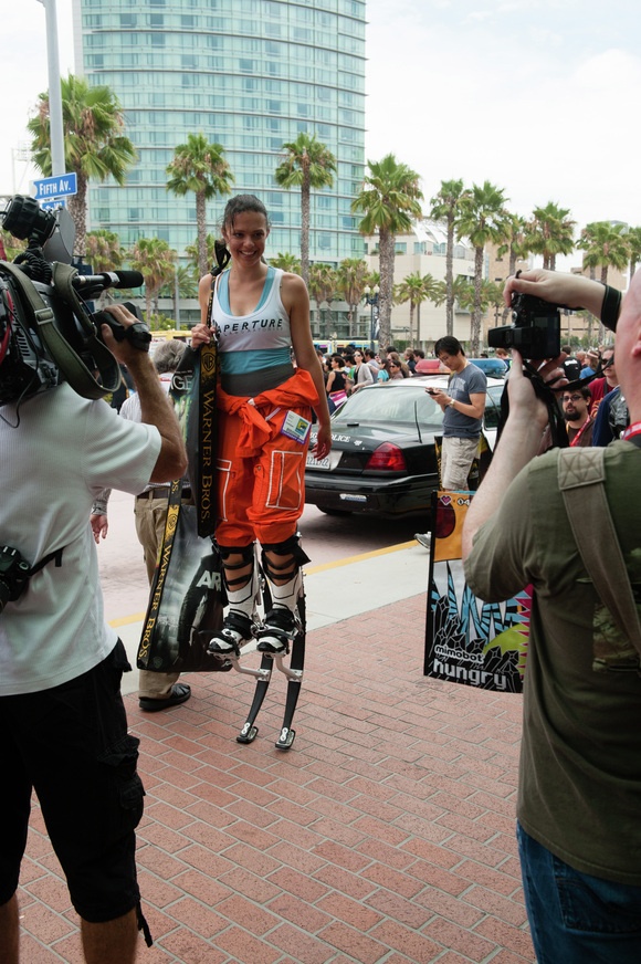 A convention-goer shows off her replica of Chell’s Long Fall Boots from Portal 2.