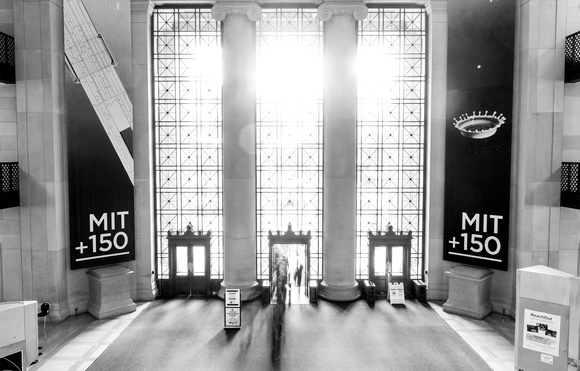 By David Da He Staff Photographer The foot traffic in Lobby 7 is captured in a long exposure as people enter from 77 Mass. Ave. The time of sunset is chosen so that sunlight floods the background. Black and white is used to provide contrast to the photo. Aperture:
ƒ/11 Exposure Time:
2.5 sec. Sensitivity:
ISO 100 Effective Focal Length:
27 mm
