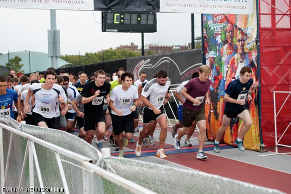Runners take off from the starting line at the sound of the signal at the 2012 fall Beaver Dash on Saturday morning. The 5K run was part of the inauguration festivities for President L. Rafael Reif and benefits Habitat for Humanity.