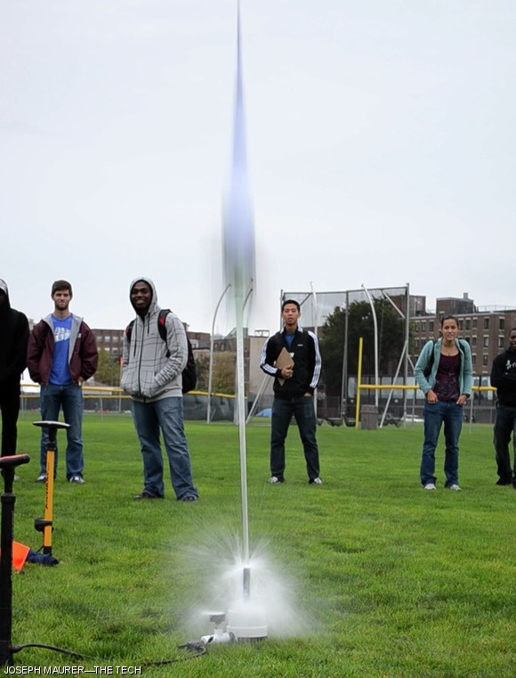 Four-tenths of a second after launch, this two-liter bottle rocket ascends above Briggs Field during a Gordon Engineering Leadership Program activity.
