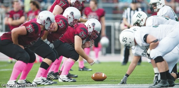The Engineers’ offensive line prepares to snap the ball during its game against Plymouth State University.