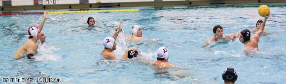 Dylan J. Hallman ’15 faces a slew of defenders as he prepares to launch the ball in Saturday’s water polo game against Connecticut College, contributing to a 13-9 win for MIT. Seniors Kevin D. Hsiue and Brendan T. Deveney were presented with signed photos in a ceremony before the game, celebrating the last home game of their careers.