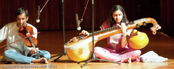 Members of MIT Swara perform at the Diwali Night celebrations held in Kresge on Sunday. The instrument pictured is the Veena, a plucked string instrument that is an essential component of India’s classical Carnatic music.