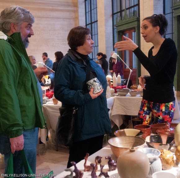 A Student Art Association representative talks to potential customers at the SAA’s ceramic sale, held on Monday in Lobby 10. The sale featured ceramic sculptures and vessels by MIT students, faculty, and staff. The MIT Glass Lab also held a sale in Lobby 10. Both sales continue today.