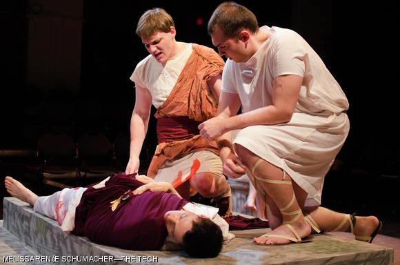 Mark Antony (Zachary D. Tribbett ’13, left) leads a Roman citizen (Salvador Esparza ‘14, right) out of a crowd to see Julius Caesar’s (Christopher D. Smith ‘13) body up close in the MIT Shakespeare Ensemble’s performance of “Julius Caesar.” The MIT Shakespeare Ensemble, composed of MIT students and community members who work together long-term to produce Shakespeare shows, are performing the play until March 23.