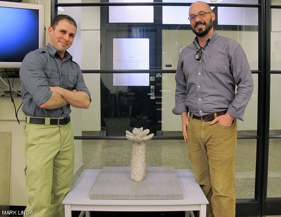Matthew S. Humbert G (left) and Michael J. Tarkanian (right) stand by the sculpture in a material science lab.