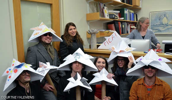 History, Theory, and Criticism of Art and Architecture students pose with the sculpture in their department offices.
