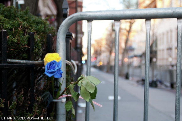 Boylston St. remained blocked off Wednesday evening after Monday’s bombings. Blue and yellow flowers, representing the colors of the Boston Marathon, were tucked into the barricade near a makeshift memorial.