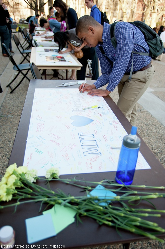 Following a “reflection” held on Kresge Lawn Wednesday afternoon, members of the MIT community sign cards for hospitals and first responders to the Boston Marathon tragedy. The reflection, hosted by Students at MIT Allied for Student Health (SMASH), featured speeches by Chancellor Eric Grimson PhD ’80 and Institute Chaplain Robert Randolph.