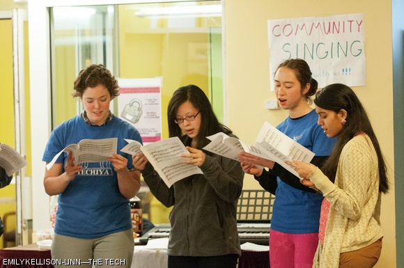 Members of Techiya, MIT’s Jewish, Hebrew, and Israeli a cappella group, hold a community singing event outside LaVerde’s on Tuesday evening. Passers-by were invited to pick up music and sing along.
