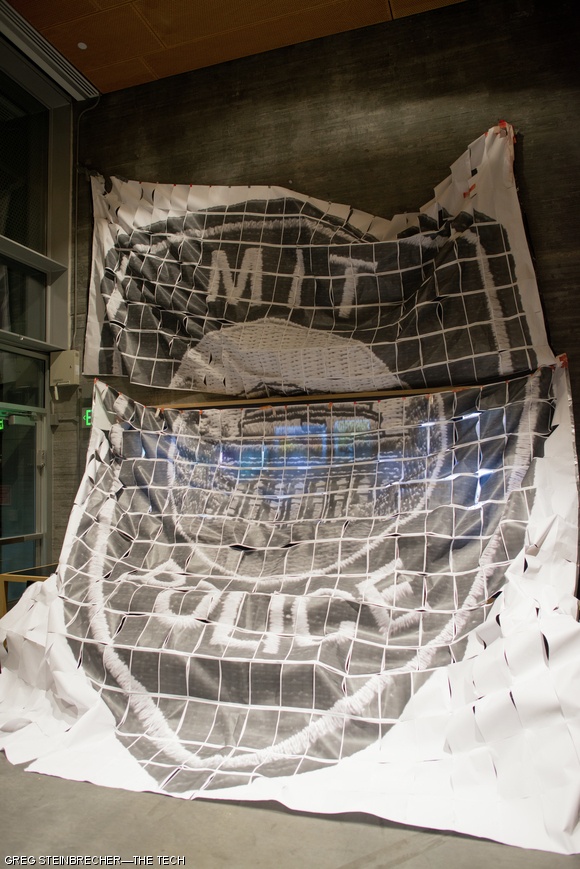 Students in Simmons Hall printed a gigantic MIT Police badge across hundreds of pieces of 8.5”x11” paper. The sheets were assembled and hung in Simmons Dining.